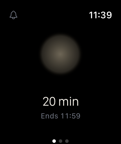 Apple Watch start screen: a soft glow, the length and the end time, with the bell in the corner